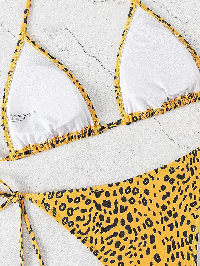 Simples Market triangle bikini set in yellow leopard print with white cups and Brazilian bottoms.