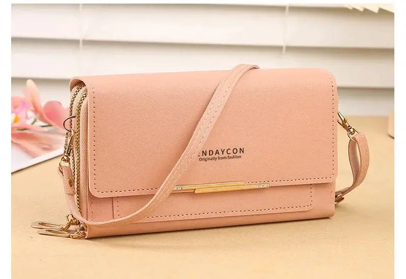 Pink women's mid-size wallet bag by NDAYCON with convertible shoulder strap and coin pocket.