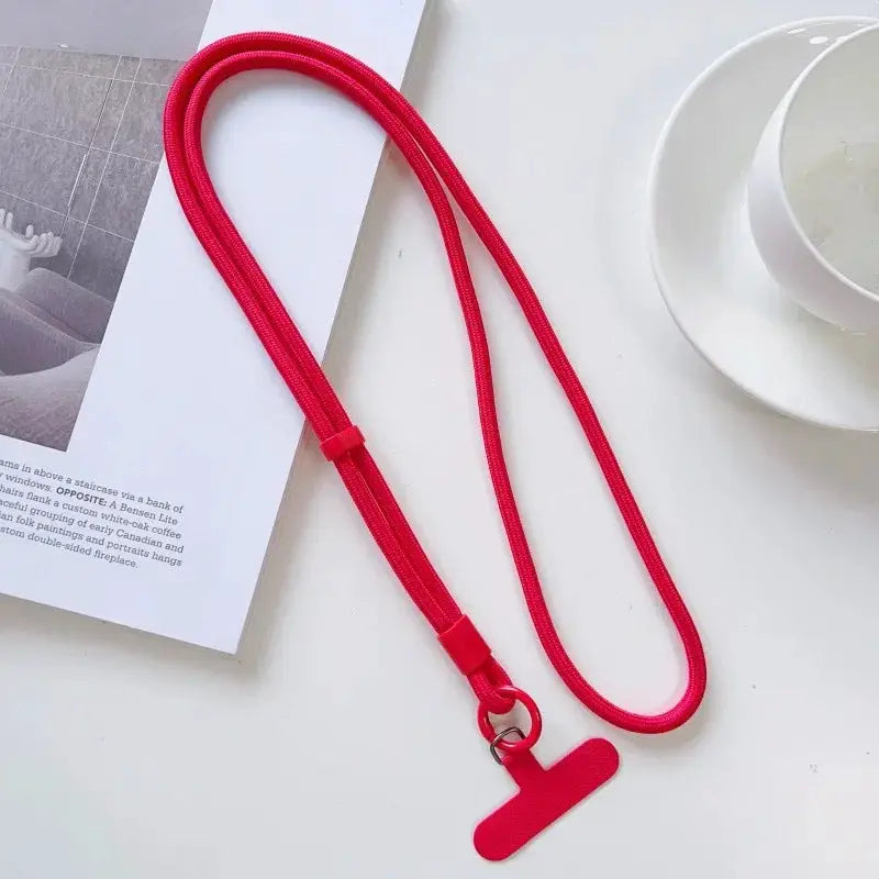 Phone lanyard red solid color crossbody rope with adjustable slider and T-shaped charm.