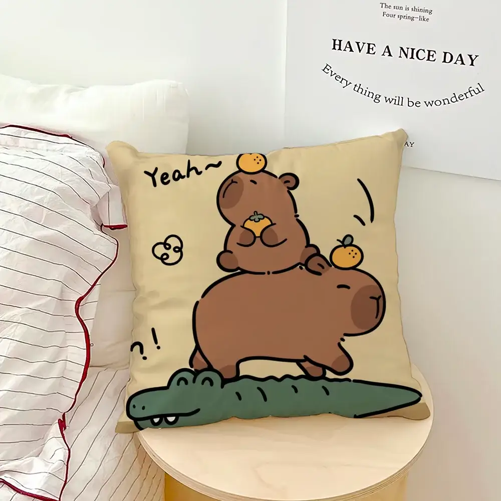 Beige square pillow cover with cartoon capybara and crocodile illustration.