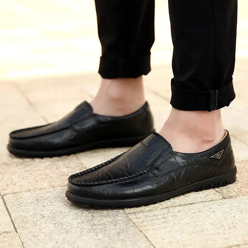 Men's black genuine leather loafers by Simples Market, slip-on moccasin style with stitching and triangle logo