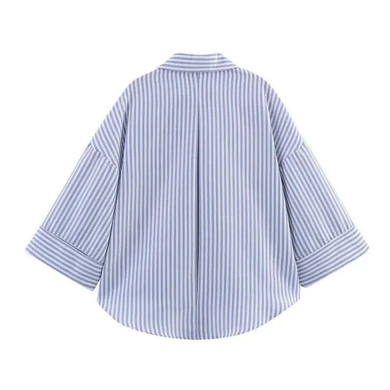Striped women's shirt in blue and white with wide sleeves