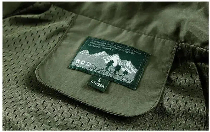 Green breathable mesh cargo vest with mountain-themed patch on the pocket.