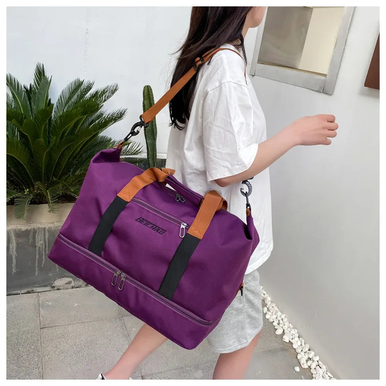Purple large-capacity travel gym bag by Simples Market with orange handles and black front straps