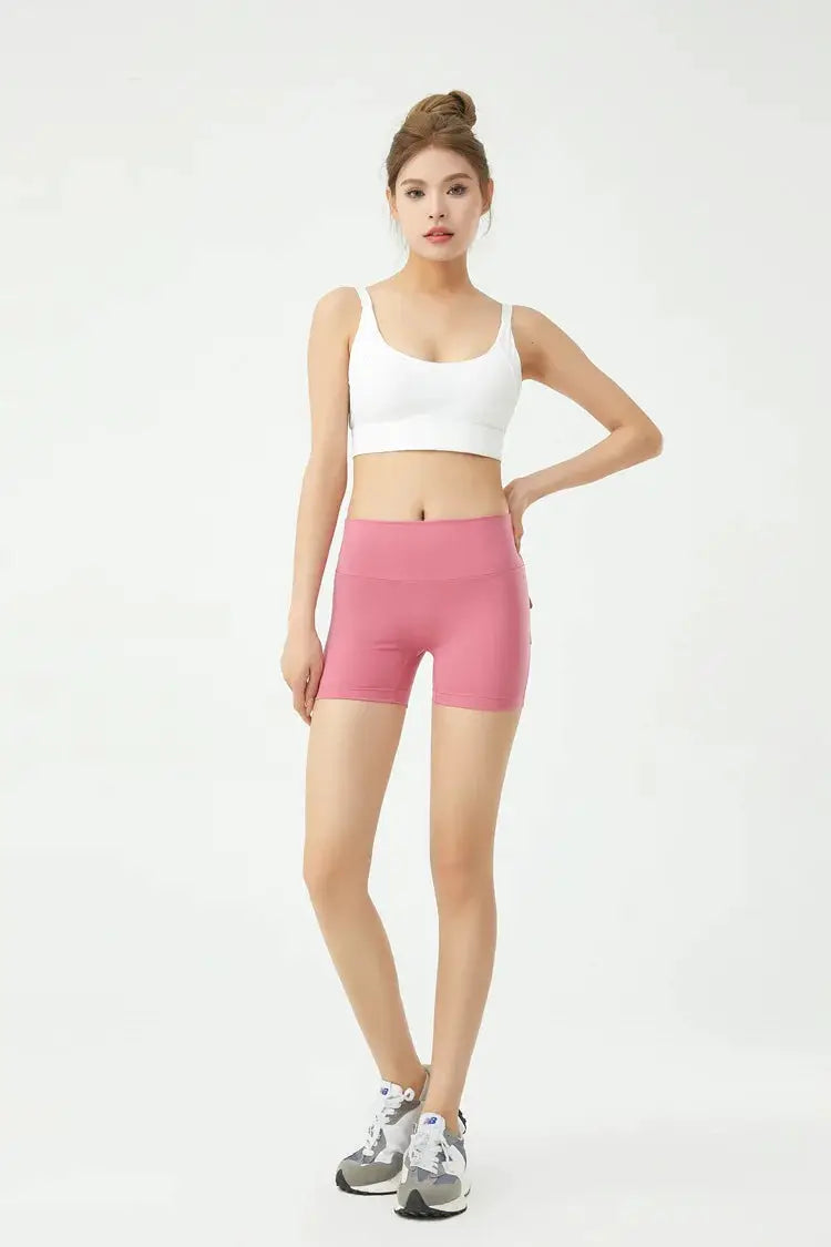 Peach pink women's fitness shorts, high-waisted, tight yoga shorts for workouts
