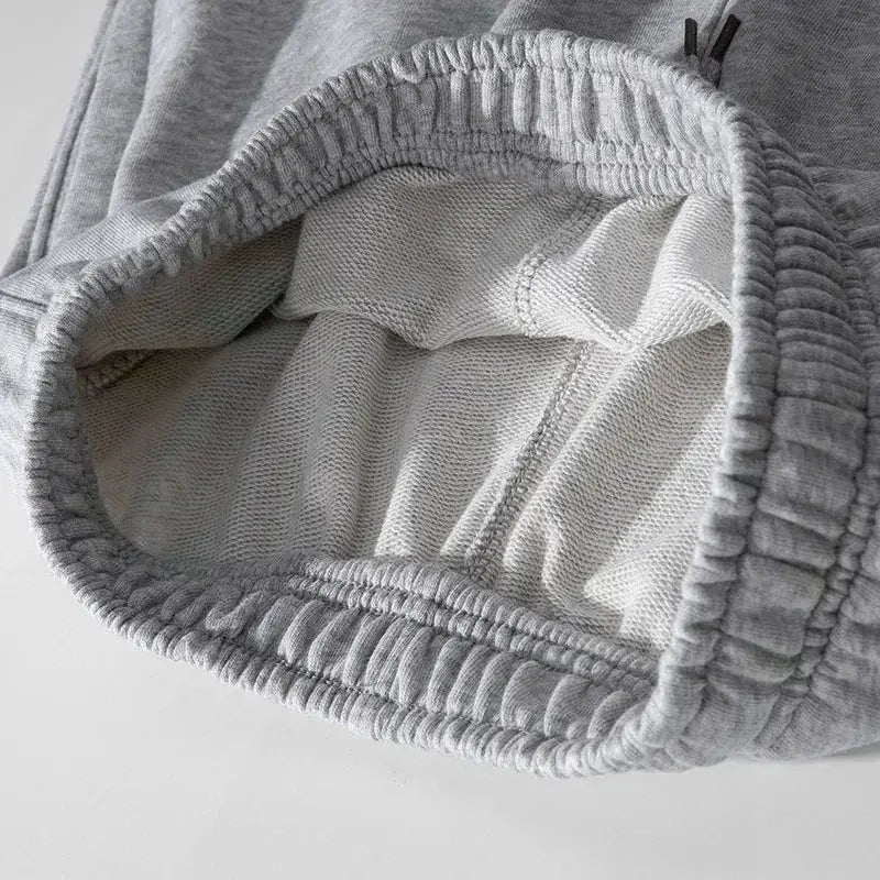 Grey cotton sweatshorts with elastic waistband and mesh lining, casual summer shorts for men and women