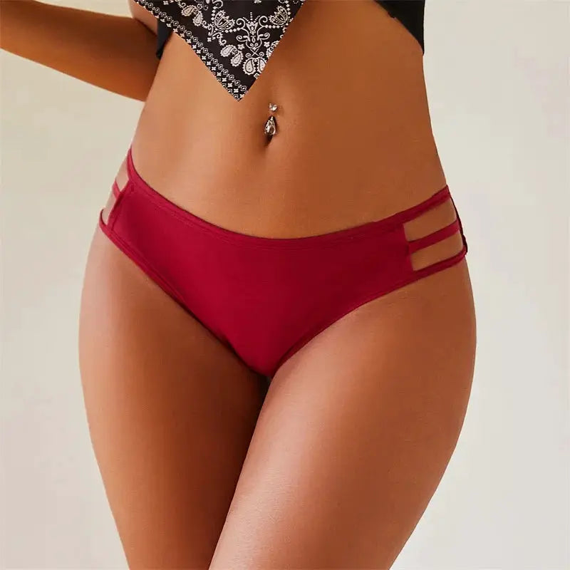 Red low-rise women's panties with double side strap cutouts and elastic waistband.