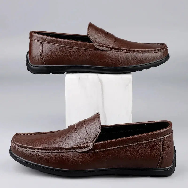 Pair of men's genuine leather loafers by Simples Market, brown slip-on dress shoes with black soles