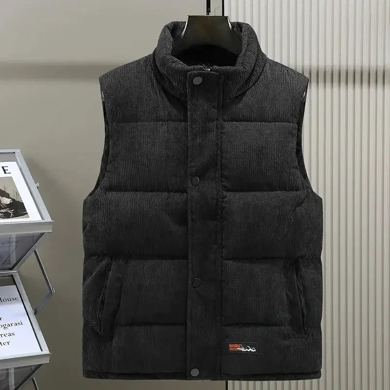 Simples Market men's padded vest in dark corduroy with stand collar and zip front.