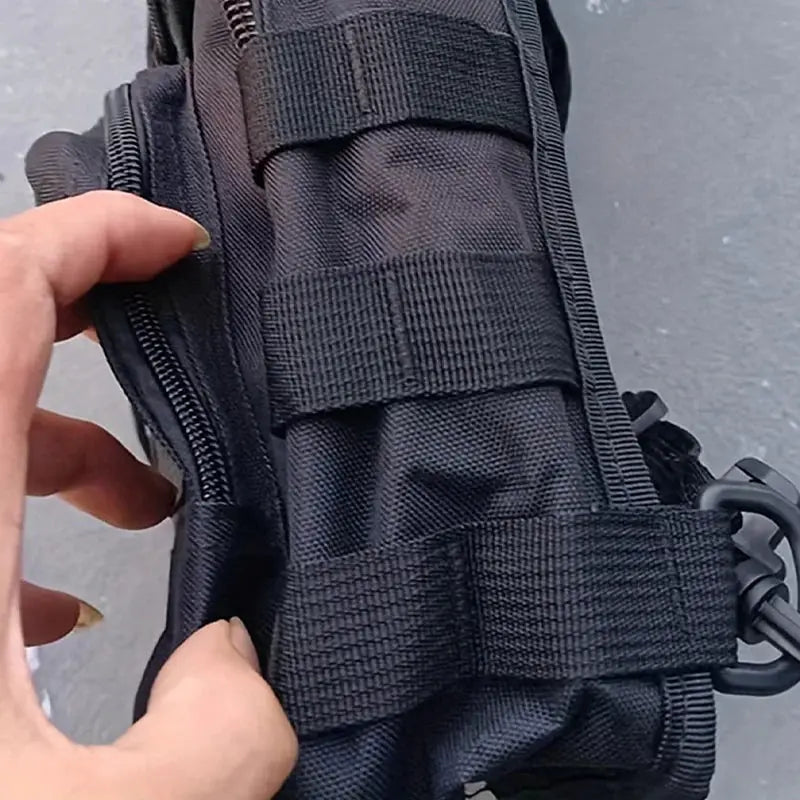 Tactical chest bag sling bag in black nylon with zip pocket and front strap attachments
