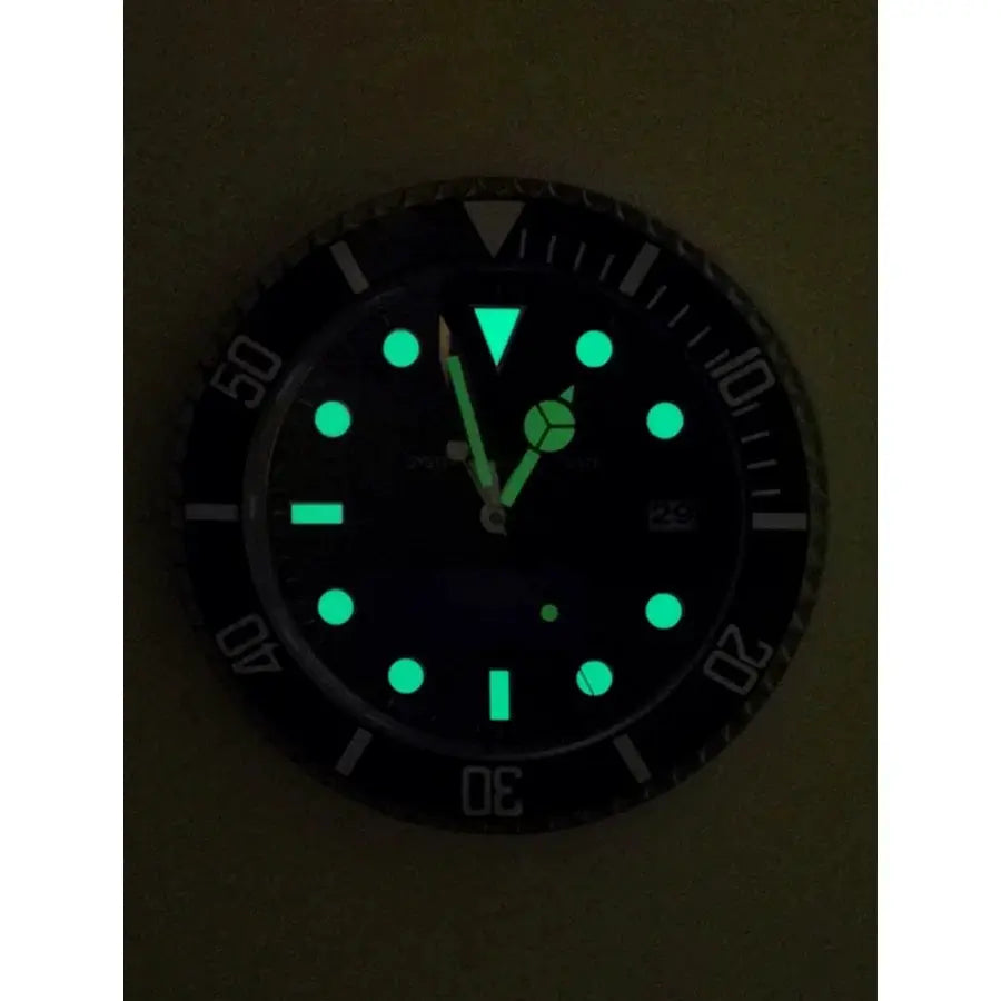 34cm Luxury Wall Clock by Simples Market; modern metal design with glow-in-the-dark green markers and date window.