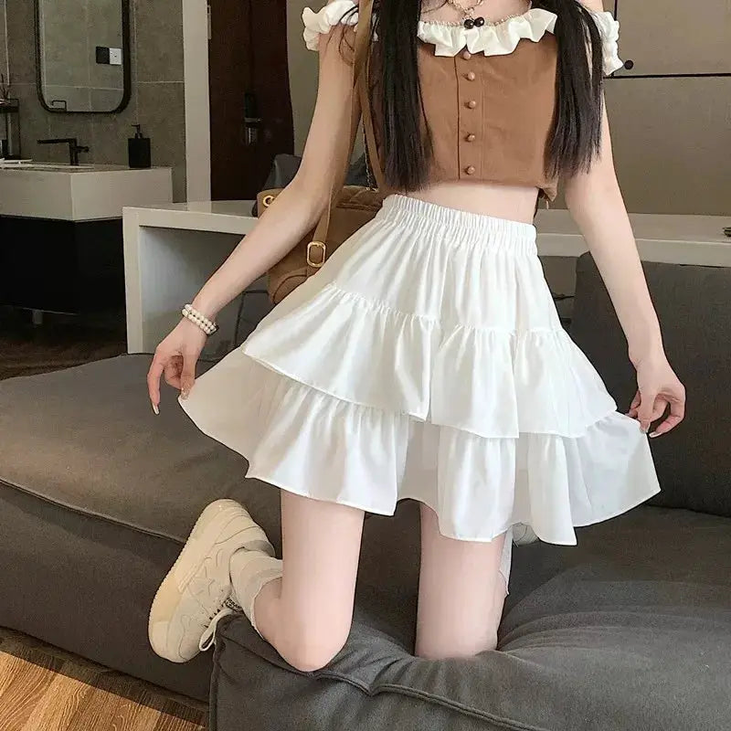 Mini white high-waist tiered A-line skirt with layered ruffles.