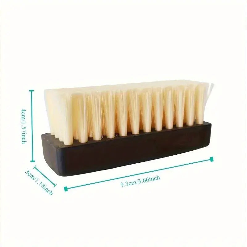 Shoe brush with cream bristles and black plastic handle; compact home-use shoe care tool, 9.3 cm long.