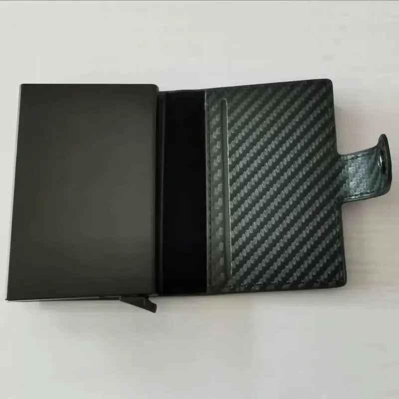 Carbon fiber RFID card holder wallet in black with a slim minimalist design and pop-up card slot