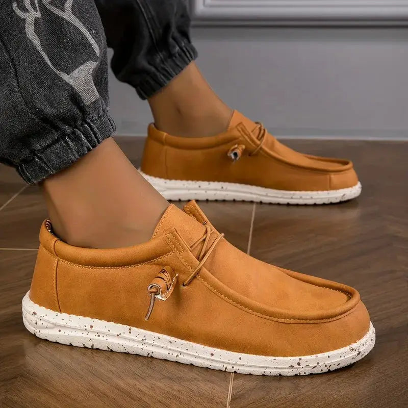 Men's brown loafers with white speckled sole; casual slip-on leather shoes