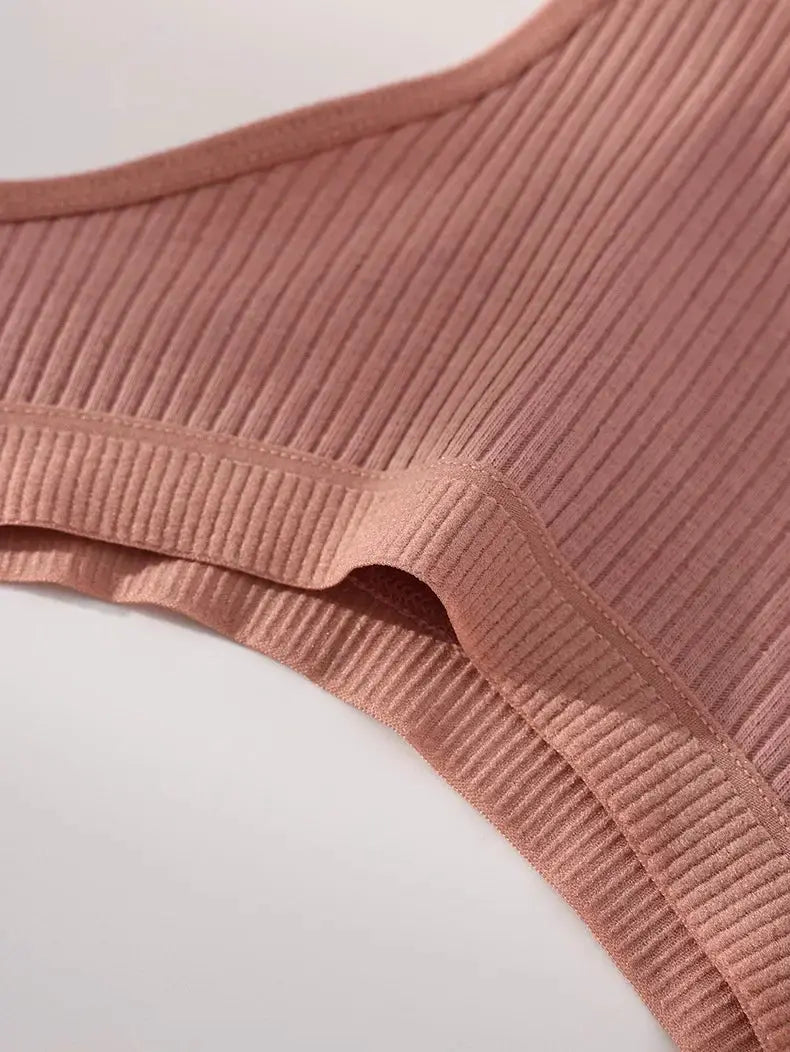 Pink ribbed cotton thong underwear for women, close-up fabric detail