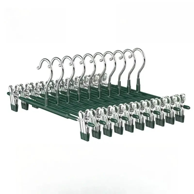 5-piece wardrobe clothes drying rack from Simples Market with stainless steel frame, chrome curved hooks, and green clips