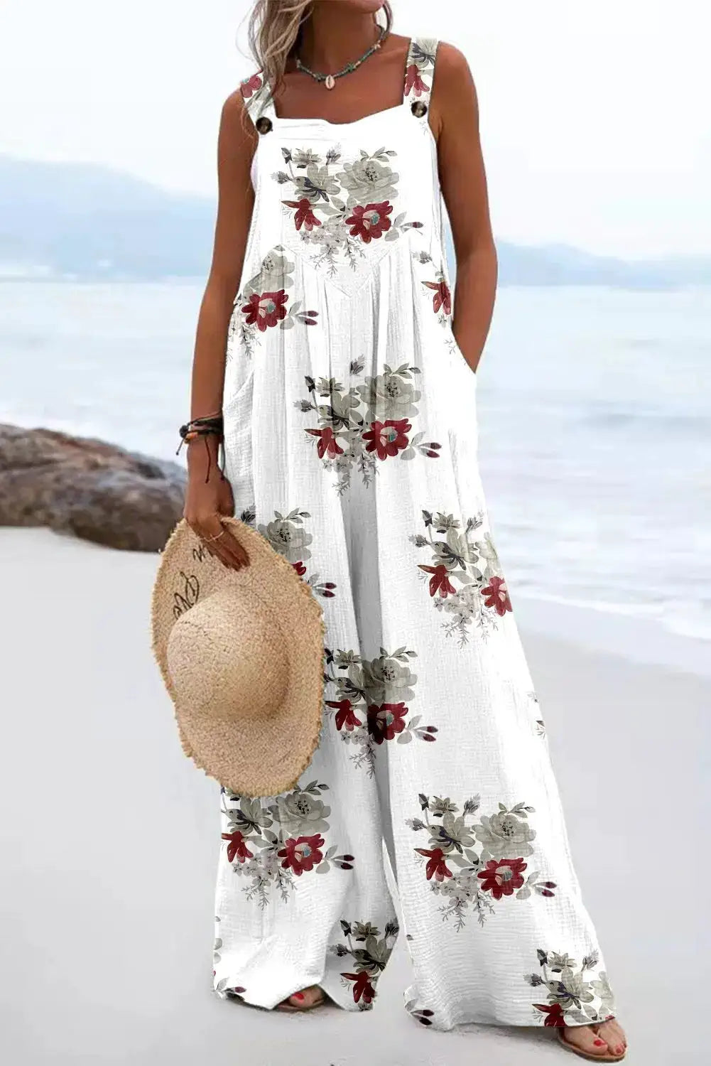 Women's sleeveless jumpsuit with vintage floral print, white background, wide-leg silhouette by Simples Market