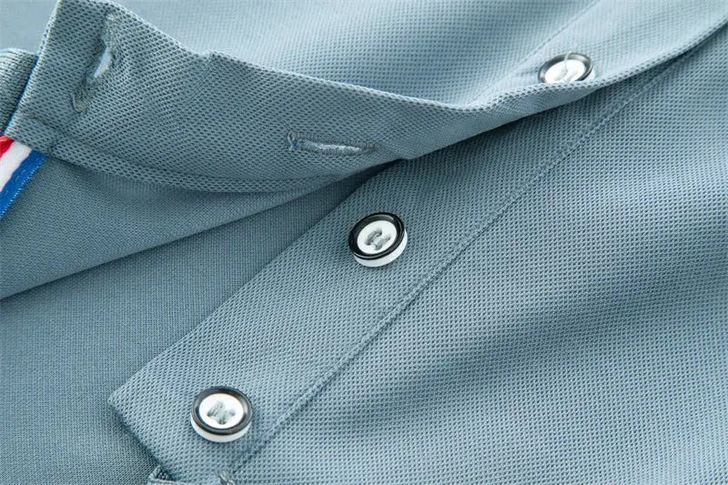 Men's light blue pique-knit polo shirt with short sleeves and button placket