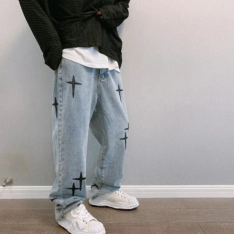 Boyfriend denim cargo pants by Simples Market in light blue with star-cross prints, loose straight-leg fit