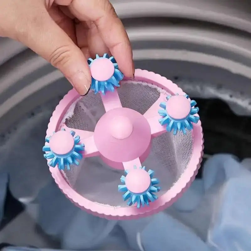 Simples Market washing machine filter bag, pink circular lint catcher with blue brush attachments.