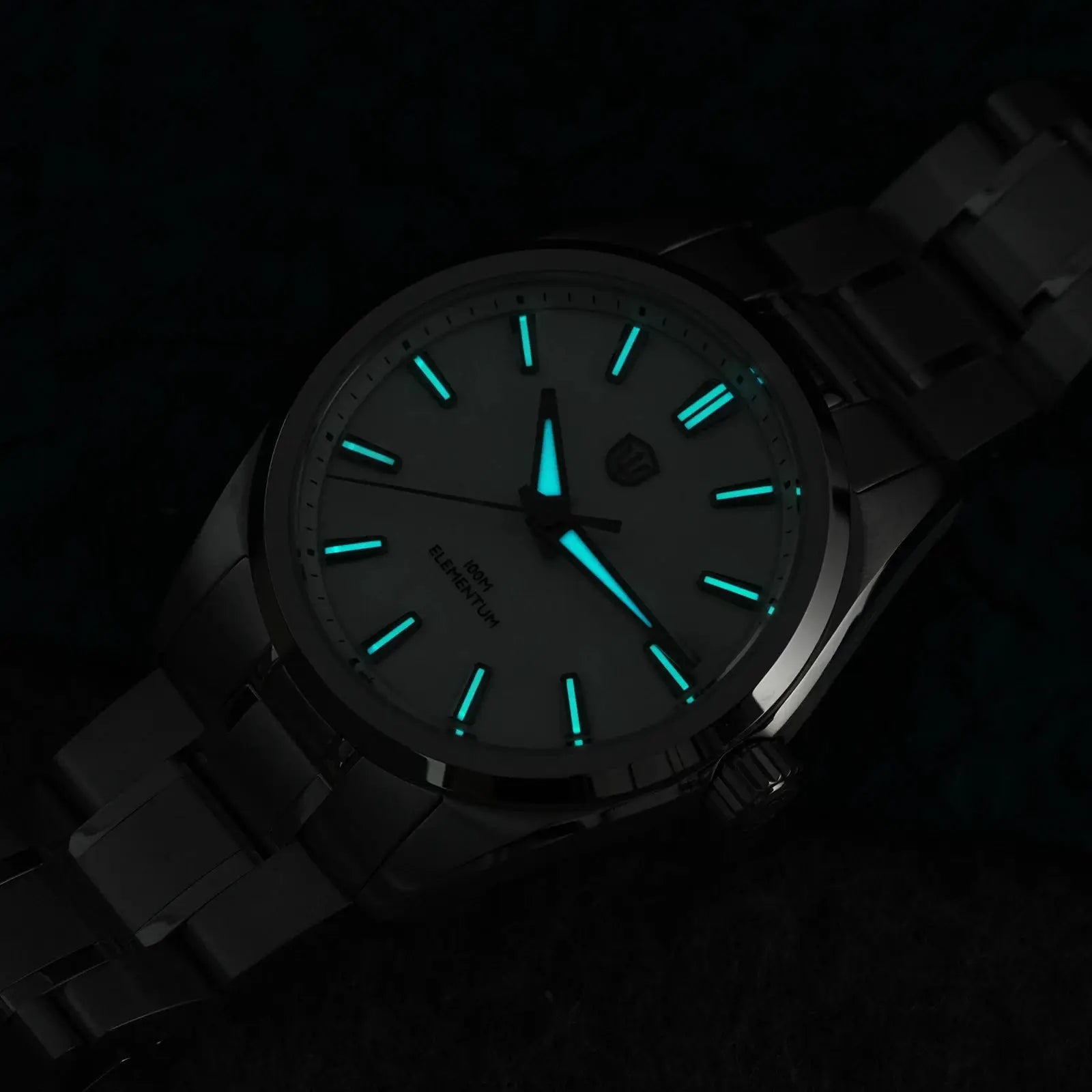 Watchdives WD0003C quartz wristwatch with stainless steel band, 38mm case, cyan luminous markers, and 100m water resistance
