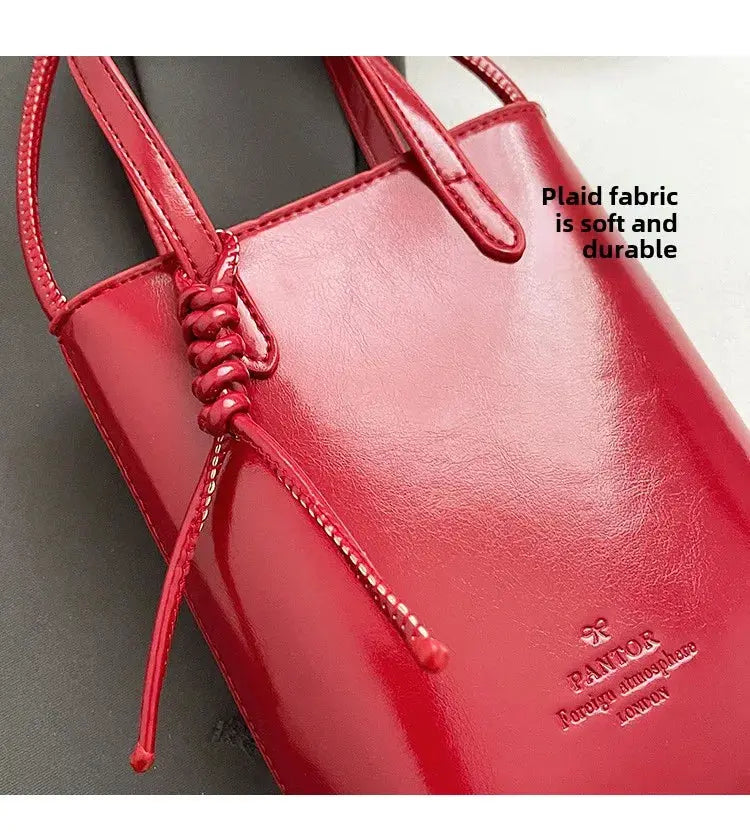 Red PU leather mini crossbody bag with braided knot detail by Simples Market