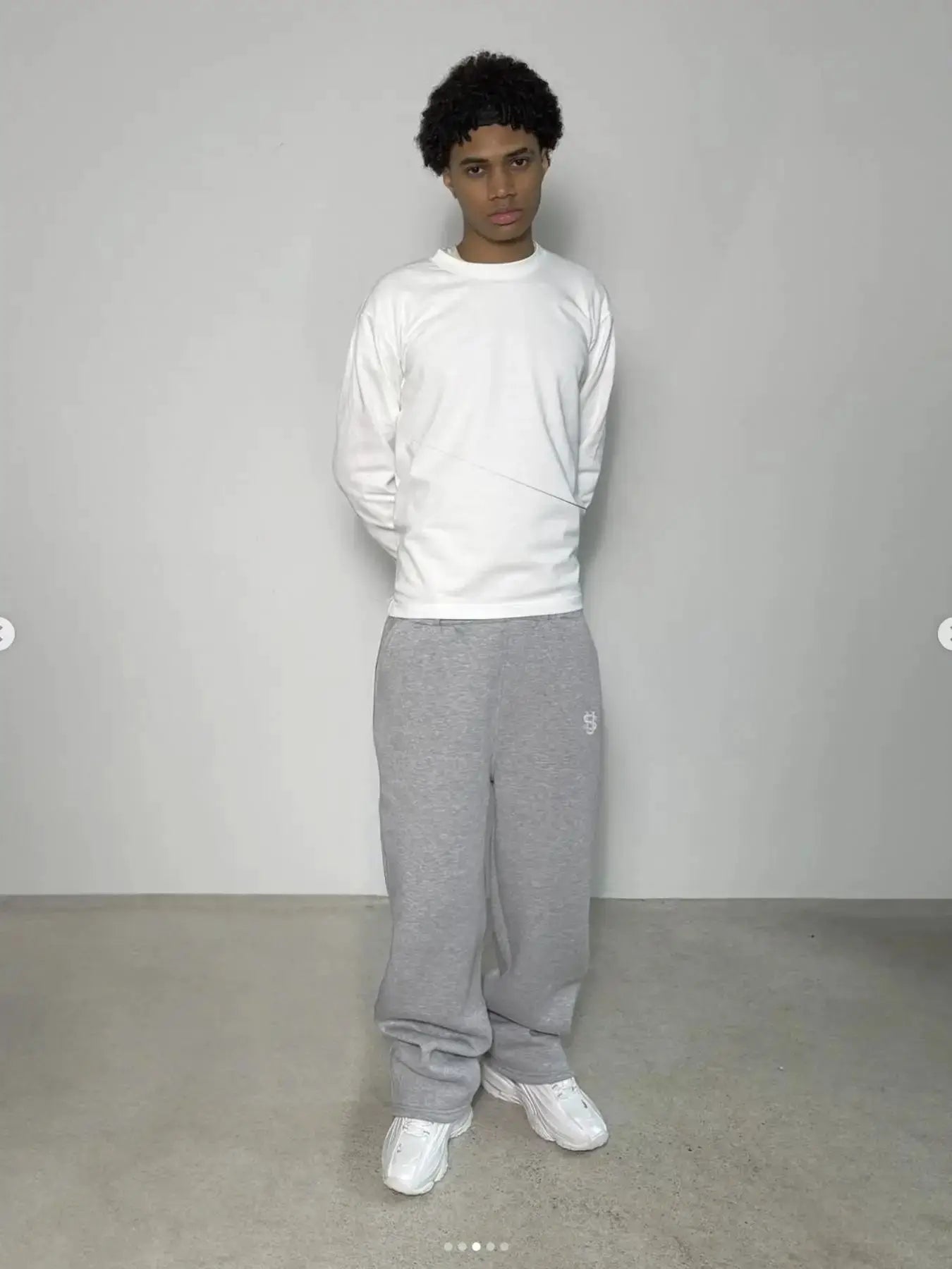 Men's grey jogger pants by Simples Market, Y2K streetwear style with a small logo.