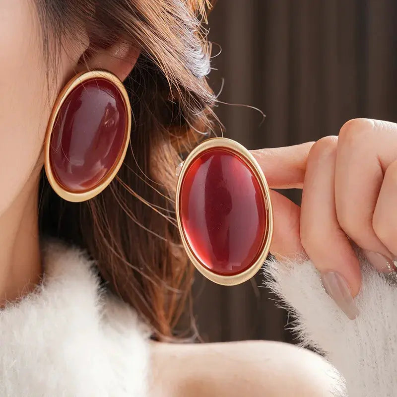Simples Market pair of vintage red resin oval stud earrings with gold-tone frames