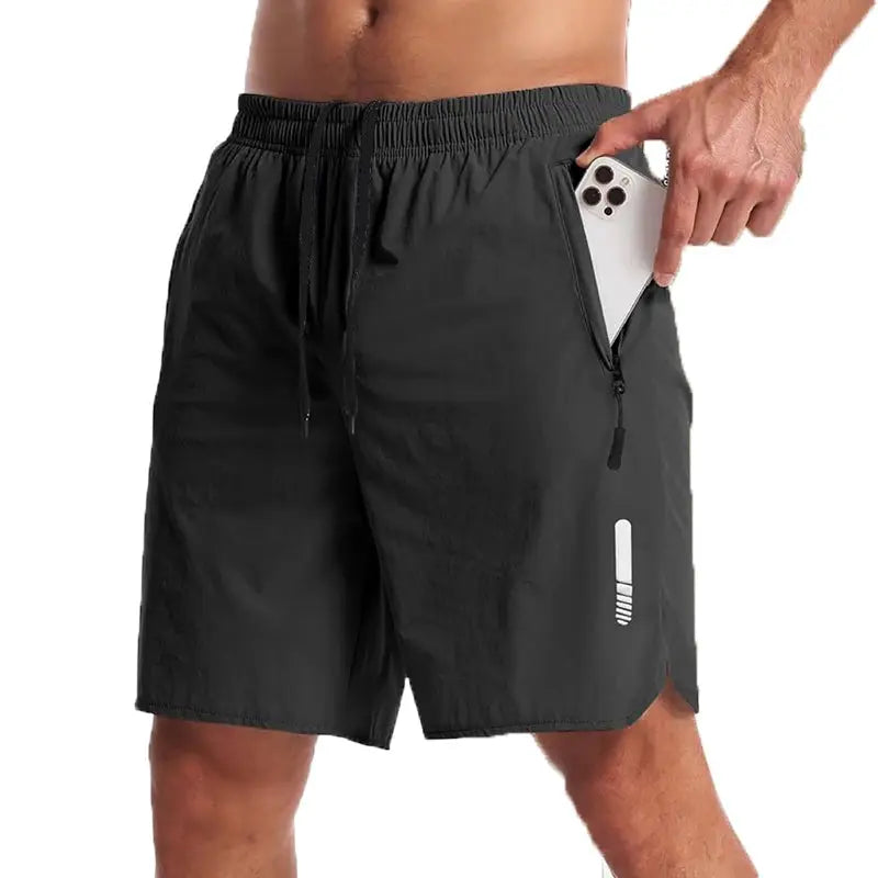 Simples Market men's black sport shorts with drawstring waist and zip side pocket holding a smartphone.