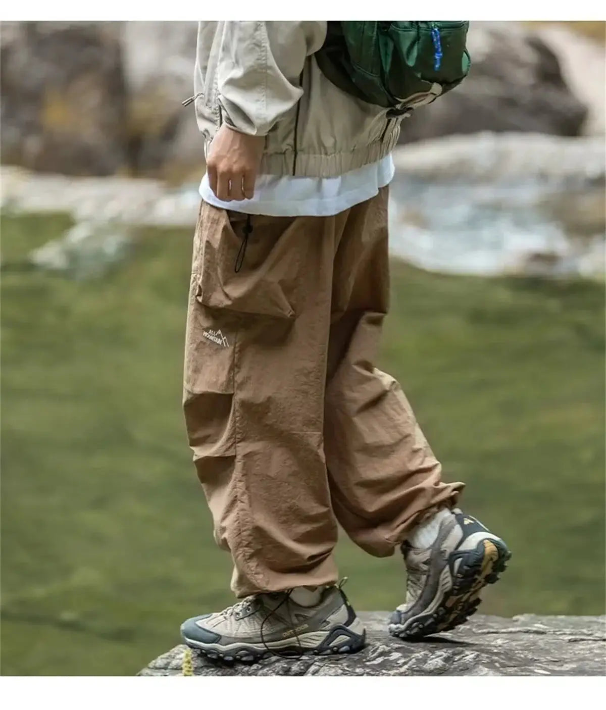 Men's waterproof cargo hiking pants in tan by Simples Market; rugged outdoor mountaineering style.