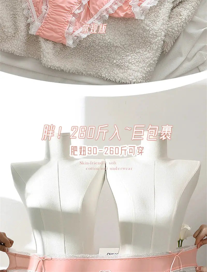 Pink lace panties with white lace trim, plus-size underwear displayed on white dress forms over plush beige blanket