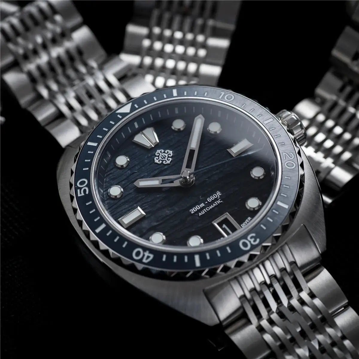 IXDAO IPOSE 2026 men's automatic dive watch with blue Poseidon-pattern dial and stainless steel bracelet