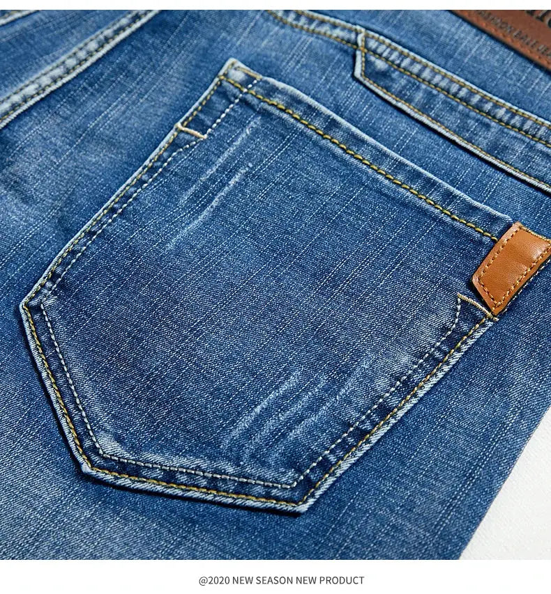 Denim shorts by Simples Market; blue jeans fabric with back pocket, yellow topstitching and a leather patch.
