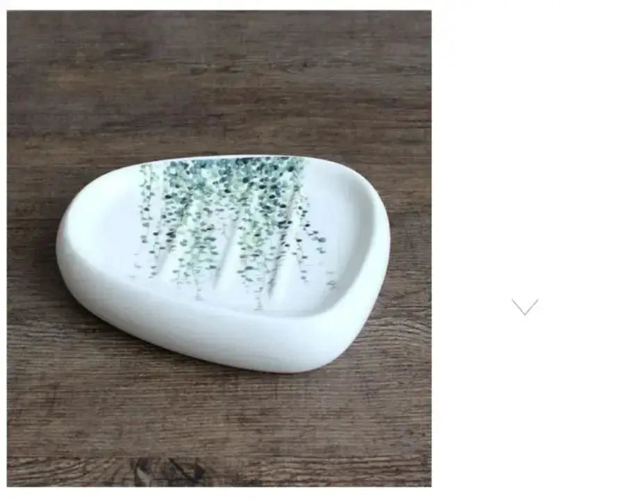 White ceramic soap dish by Simples Market with green botanical pattern