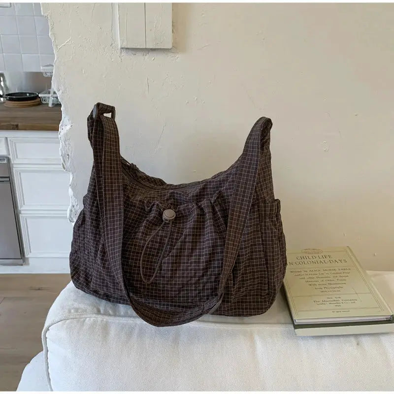 Korean nylon shoulder bag in brown plaid by Simples Market with drawstring closure