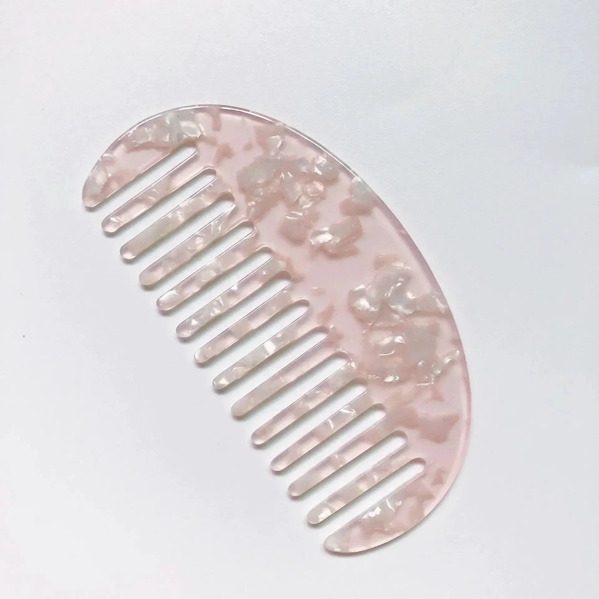 Wide-teeth acetate hair comb in pink marble pattern; anti-static massage styling travel accessory