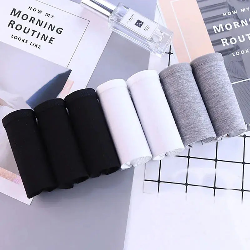 Simples Market 7Pcs women's cotton panties set in black, white, pink, and gray; breathable soft briefs for plus size.
