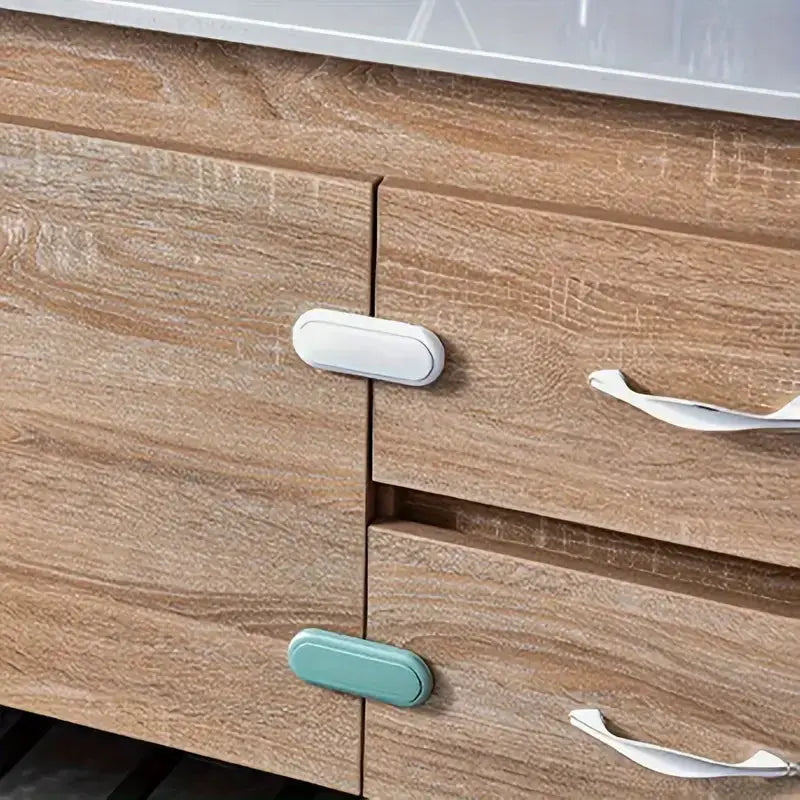 Simples Market 3-piece invisible magnetic cabinet lock set for wooden cabinets; white and teal locks shown.