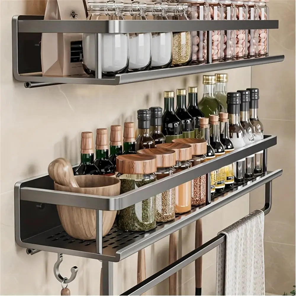 Simples Market wall-mounted metal seasoning rack with two shelves and hanging rod, holding jars and bottles.