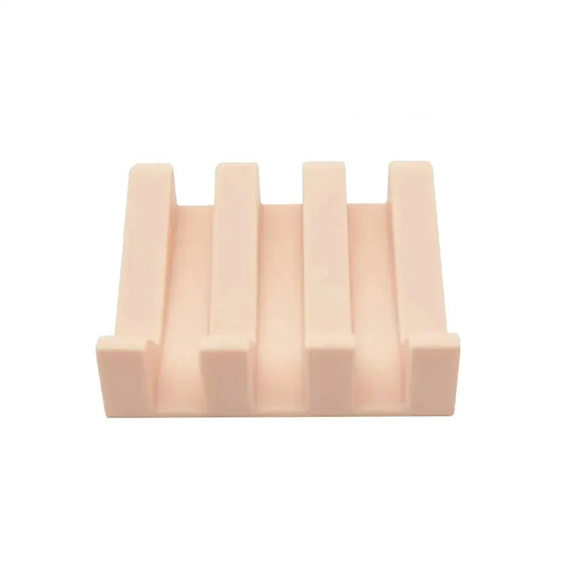 Silicone soap dish rack by Simples Market, pale pink with tilt drain for soap and sponge storage