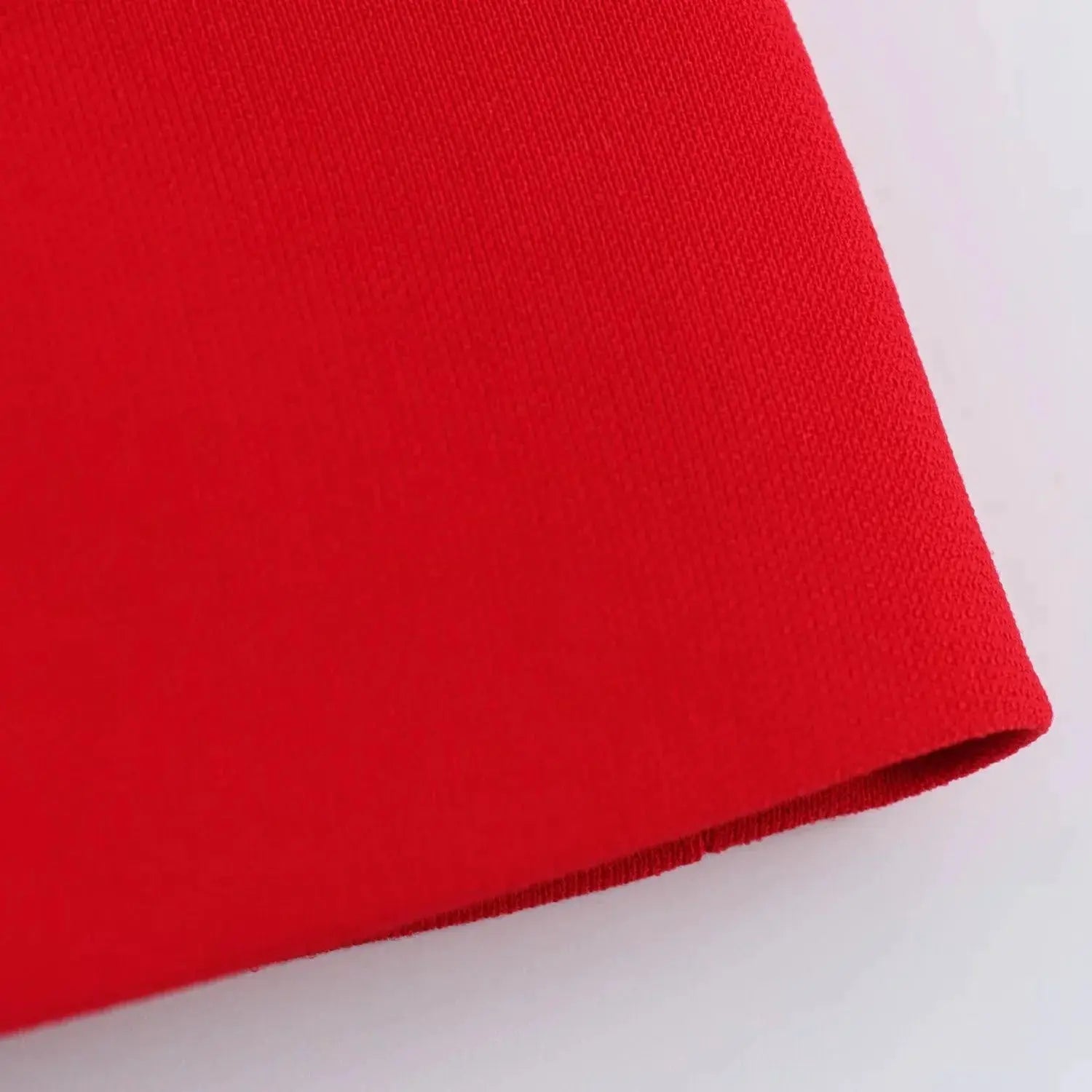 KONDALA red sleeveless blazer fabric close-up, textured knit