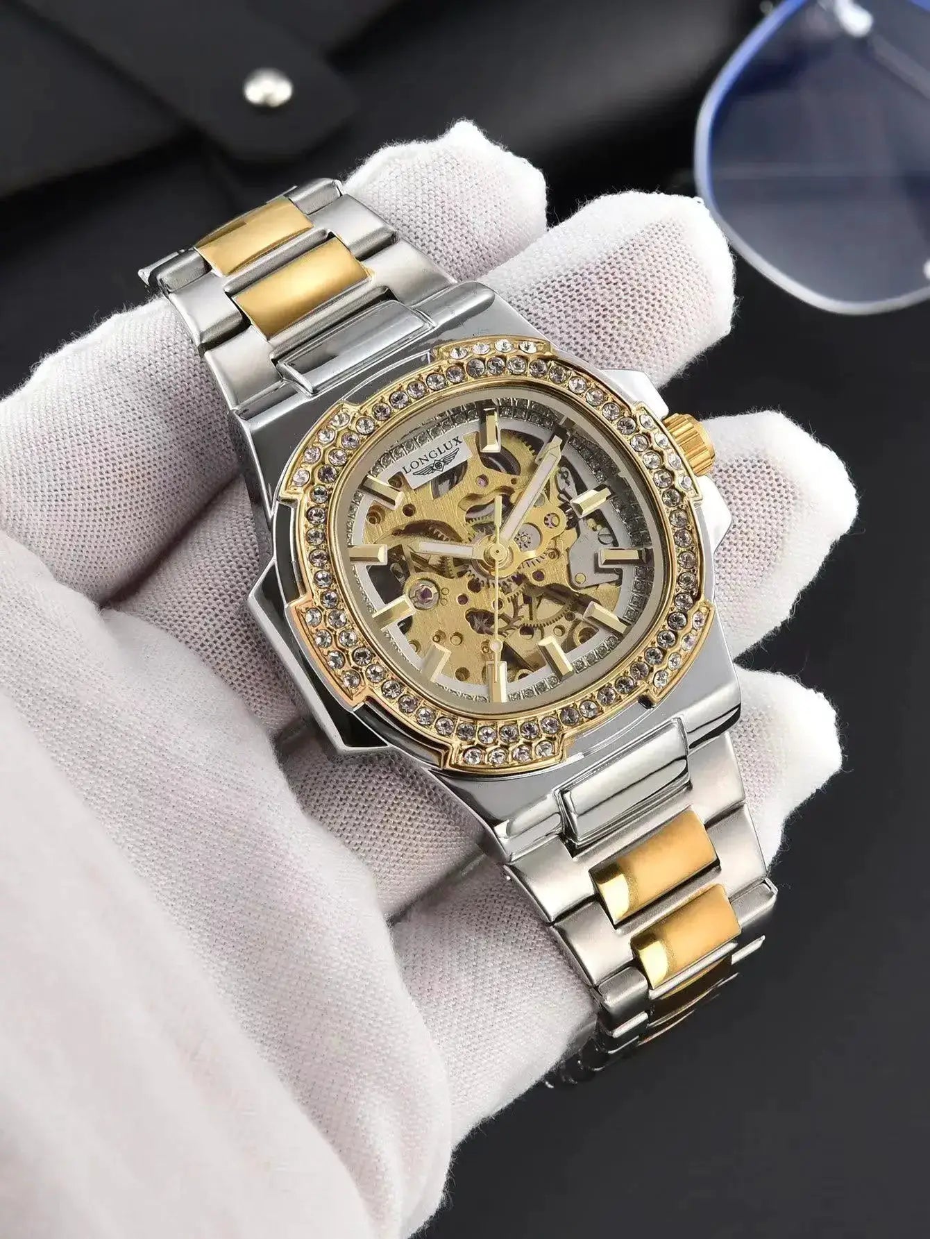 LONGLUX skeleton automatic wristwatch; two-tone stainless steel bracelet with a diamond-studded bezel