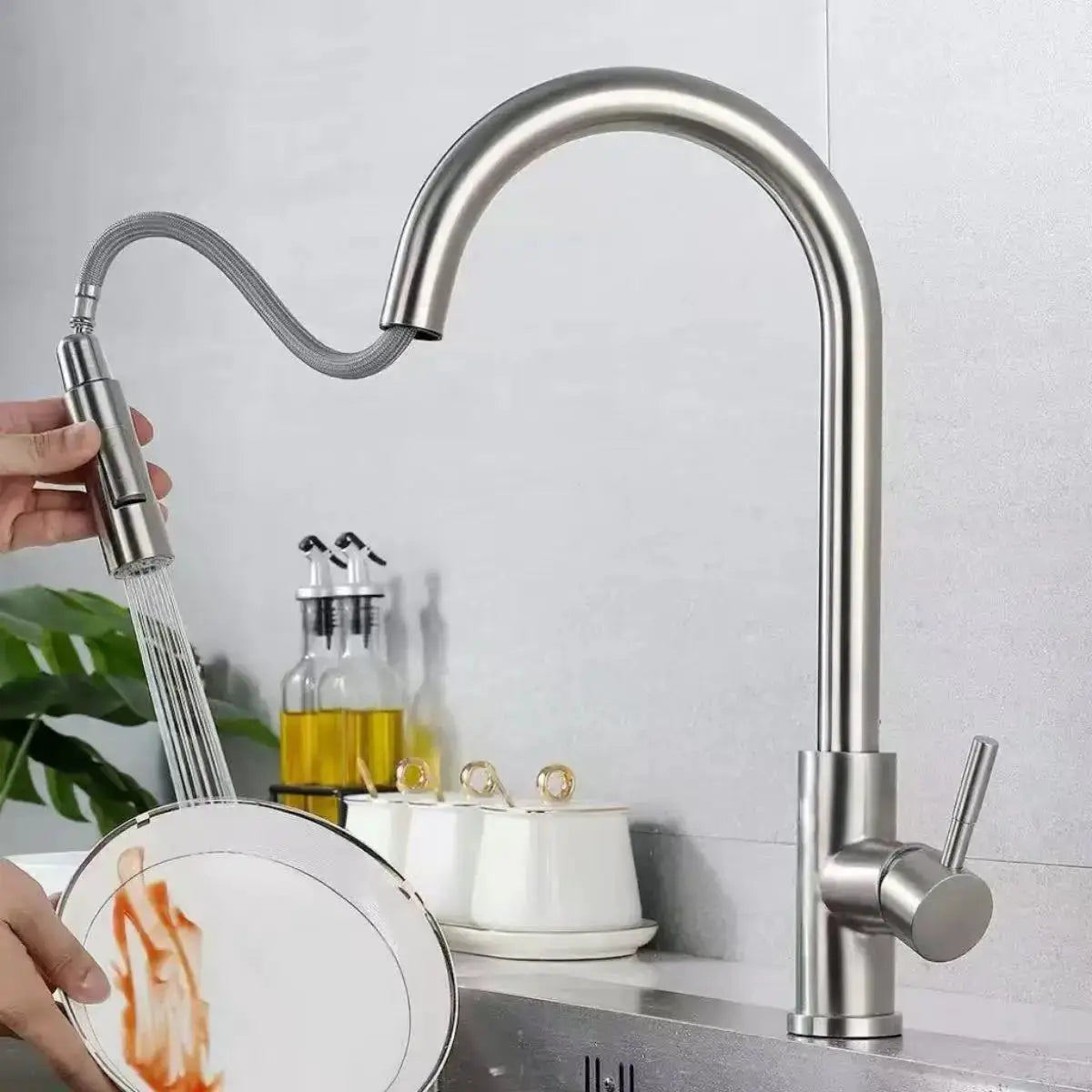 Gooseneck kitchen faucet with pull-out spray, stainless steel finish, two modes, deck-mounted mixer.