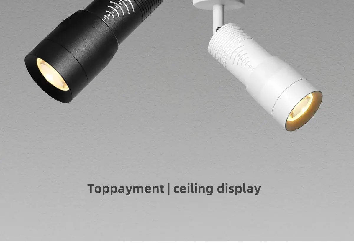 Two adjustable LED ceiling spotlights in black and white, 7W zoomable, surface-mounted.