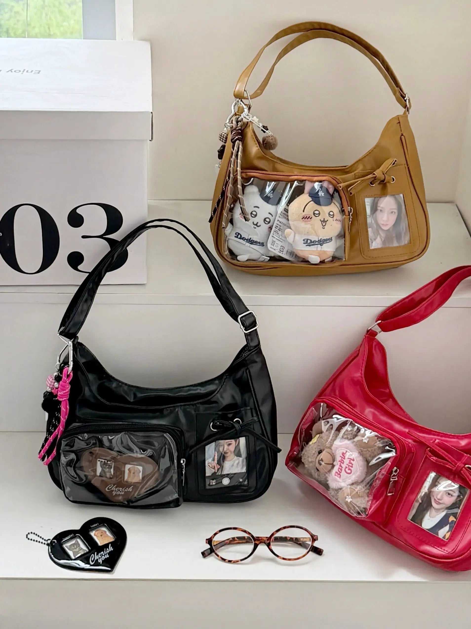 Y2K Harajuku ita bag shoulder bag, tan faux leather with a clear front pocket showing plush character dolls