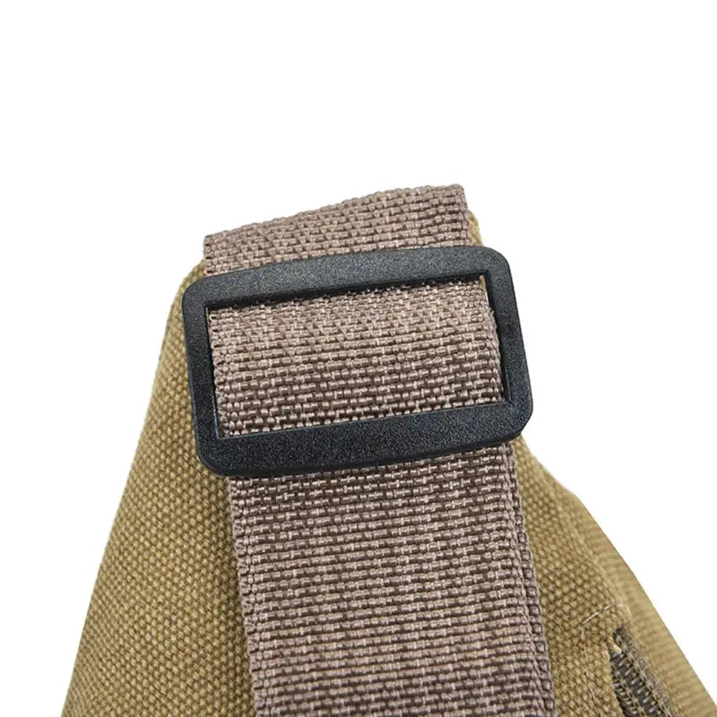 Canvas waist bag with tan strap and black buckle; compact travel bag for phone and essentials