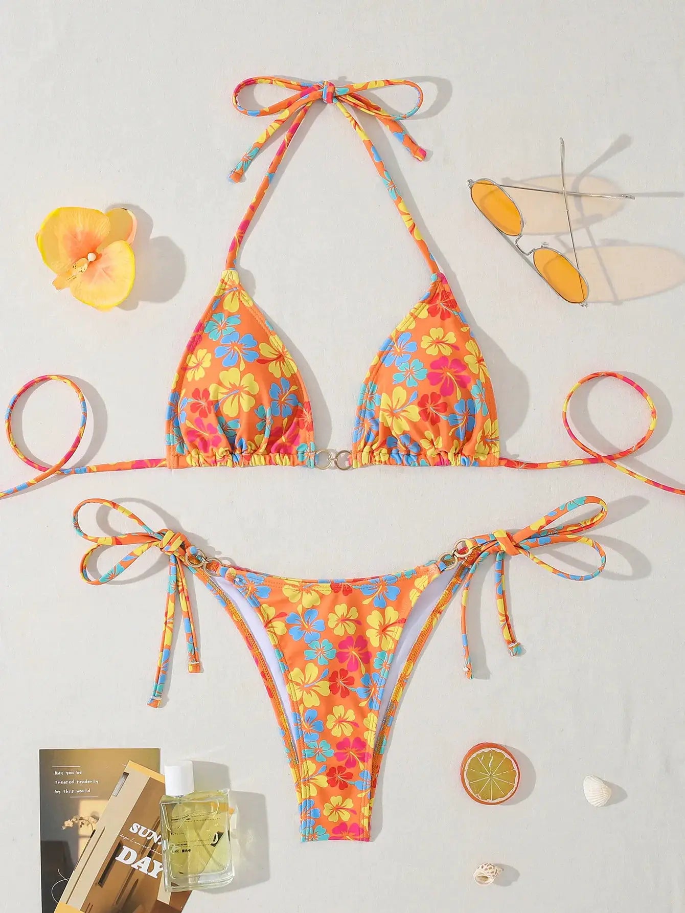 Women's orange floral bikini set with halter triangle top and tie-side bottoms
