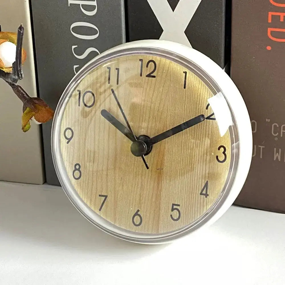 Mini Sucker wall clock 7cm with wood-grain dial and white frame, black hands.