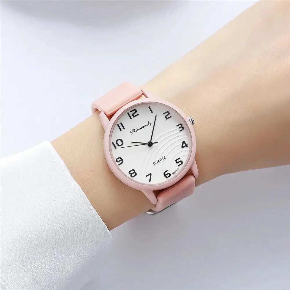 Womens pink silicone-band quartz watch with Arabic dial by Simples Market.